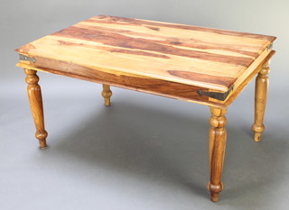 A rectangular Indian hardwood dining table of plank construction with iron banding, raised on turned supports 28 1/2"h x 53"l x 36"w 