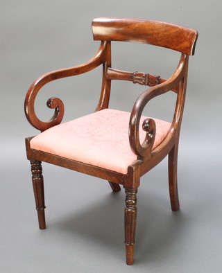 A 19th Century mahogany bar back dining chair with carved mid rail and upholstered drop in seat, raised on turned and reeded supports 