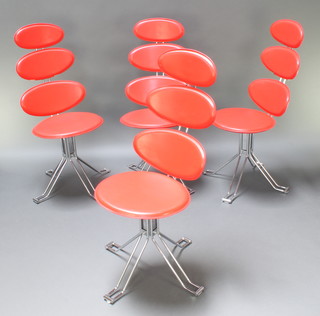 4 mid Century chromium plated and red rexine finished revolving dining chairs 