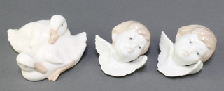 A pair of Lladro busts of Angels, a Nao group of ducks 4" 