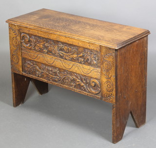 A carved oak coffer of panelled construction, the front carved oak leaves, 24"h x 33"w x 13 1/2"d 