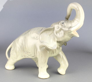 A Continental porcelain figure of a rearing elephant 11" 