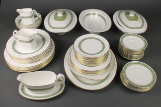 A  Royal Doulton Rondelay pattern dinner service comprising 9 coffee cans, 8 tea cups, 19 saucers, small tea pot, large tea pot, coffee pot, 2 cream jugs, 2 milk jugs, slop bowl, sugar bowl, 12 tea plates, 6 small plates, 6 medium plates, 6 dinner plates, 6 soup bowls, 2 tureens and lids, 2 serving plates, sauceboat and stand and a bowl