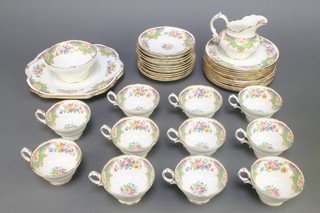 A Hammersley & Co floral teaset comprising 11 tea cups, 12 saucers, 12 tea plates, 2 sandwich plates, 1 milk jug and 1 sugar bowl 