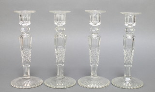 A set of 4 cut glass tapered candlesticks with hobnail decoration 12" 