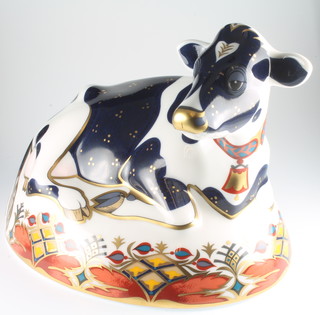 A Royal Crown Derby Japan pattern paperweight in the form of as Friesian Cow "Buttercup" with gold stopper, boxed 6 1/2"