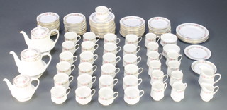 A Paragon and Royal Albert Belinda pattern part tea and coffee service comprising 25 tea cups, 10 coffee cups, 39 saucers, a breakfast teapot, 2 large tea pots, a cream jug, a milk jug and 2 sugar bowls, 36 sandwich plates, 4 medium plates and 2 cake stand tiers 