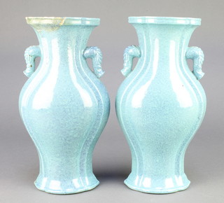A pair of Chinese blue glazed flattened oviform vases with stylised elephant handles 9 1/2" 