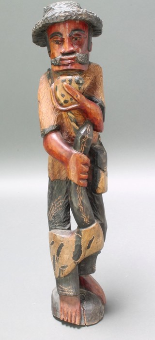 A carved hardwood figure of a standing gentleman 41" 