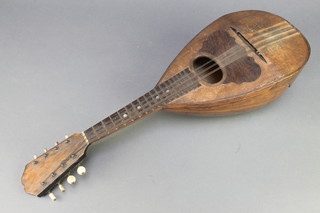A mandolin labelled Rdiano Poggeli  Fabricante Di Strumenti Napoli 