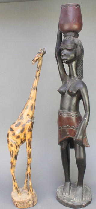 A carved African figure of a standing lady 20" and a ditto giraffe 23 1/2" 