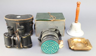 A World War Two civilian gas mask (rubber perished), an aluminium hand bell formed from a crashed aircraft over Britain with replacement handle, 2 Trench Art ashtrays decorated the Arms of Ypres and Arras together with a pair of Bino Prism No.2 Mk 2 x 6 field glasses 