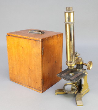 A 19th Century brassed student's single pillar microscope with mahogany carrying case containing various lenses 