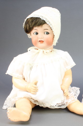 A Simon and Halbig porcelain headed doll with sleep eyes, open mouth with 2 teeth, the head incised Simon Halbig German 158, with articulated body 20" and 2 fans