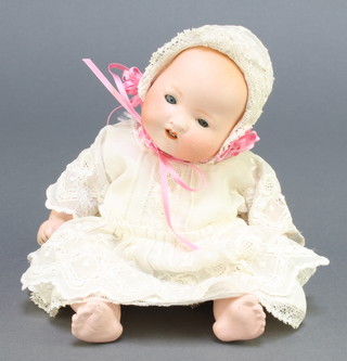 An Armand Marseille porcelain headed baby doll with sleep eyes, open mouth with 2 teeth, head incised A M German 351/M/OK 6" 
