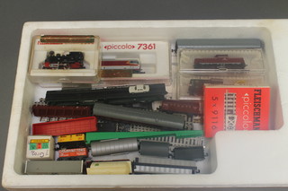 A Fleischmann N gauge diesel double headed locomotive, ditto tank engine together with 2 N gauge diesel locomotives and a quantity of various rolling stock and rails 