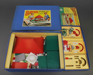 A Bayko building set no.3 together with instructions and plans for a no.4 set, boxed