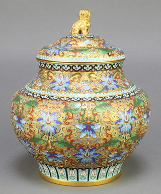 A Chinese cloisonne pink ground and floral patterned enamelled urn and cover, the lid in the form of a seated Dog of Fo 8" 