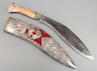 A presentation Kukri with 11" blade contained in a plush and "silver" mounted case with inscription 