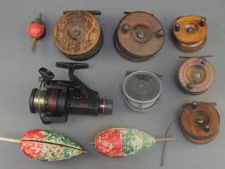 A Hardy's brass and aluminum centrepin fishing reel 2 1/2" (f), 5 mahogany and brass centrepin fishing reels (2f), a Camaro LS multiplying fishing rod and 3 floats 
