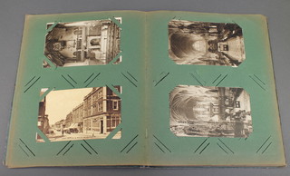A postcard album containing various colour and black and white postcards