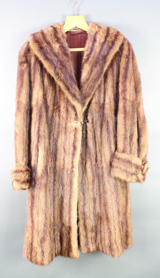 A lady's full length fur coat together with a full length Beaver lamb coat