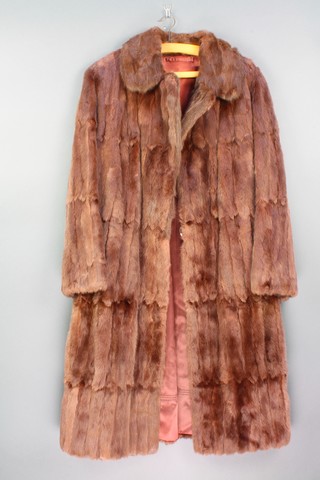 A lady's brown full length fur coat supplied by A Dudkin of Brighton 