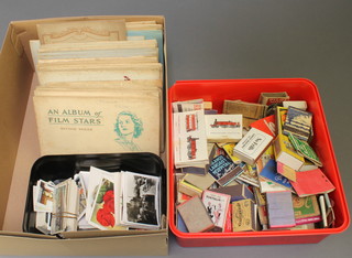 Various Players and Wills cigarette card albums, a collection of loose cigarette cards and a quantity of matchbox covers 