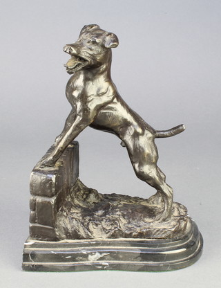 A bronze book end in the form of a standing terrier by a wall, raised on a stepped marble base 8" 
