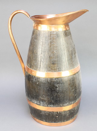 From the estate of Captain Eric M Brown a "Royal Navy" coopered oak and copper grog jug" 23"
 
