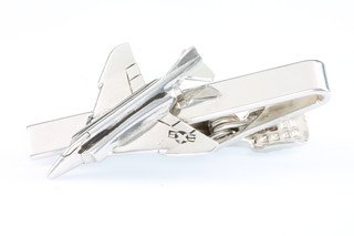From the estate of Captain Eric M Brown a white metal tie clip in the form of a FGR4 Phantom