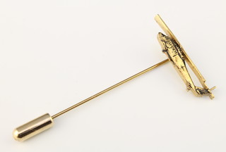 From the estate of Captain Eric M Brown a gilt metal stick pin in the form of a Sikorsky UH-60 Black Hawk helicopter