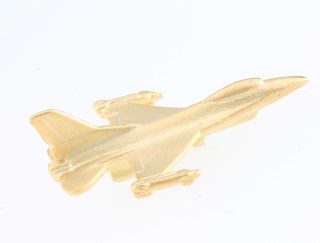 From the estate of Captain Eric M Brown a gilt lapel pin in the form of an F-16 fighter jet 