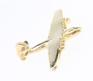 From the estate of Captain Eric M Brown a gilt pin in the form of The Spruce Goose