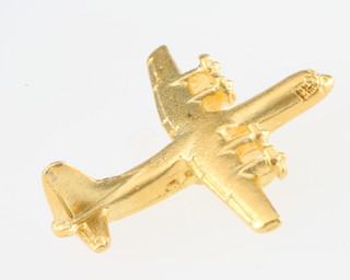 From the estate of Captain Eric M Brown a gilt metal lapel pin in the form of a Super Hercules C130J