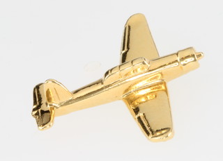 From the estate of Captain Eric M Brown a gilt pin in the form of a Blackburn Skua