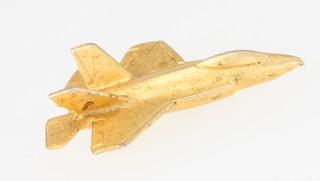 From the estate of Captain Eric M Brown a gilt pin in the form of a F-35 Fighter Jet