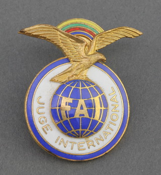 From the estate of Captain Eric M Brown a French gilt metal and enamelled Federation Aeronautique International lapel badge 