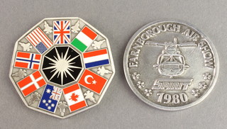 From the estate of Captain Eric M Brown a 1980 Farnborough Air Show United Technologies medallion, a white metal and enamelled F-35 First Flight Lightning II medallion 