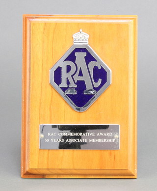 From the estate of Captain Eric M Brown a chrome and enamelled RAC commemorative award 50 years Associate Membership, mounted on a teak plaque 