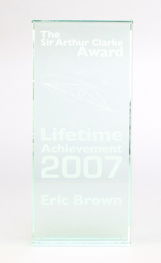From the estate of Captain Eric M Brown a rectangular etched glass The Sir Arthur Clarke Award Lifetime Achievement 2007 Eric Brown 8 1/2" x 3 1/2" x 1" 