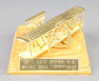 From the estate of Captain Eric M Brown a presentation desk clock commemorating the Centenary of the Wright Brothers in the form of The Wright Flyer with plaque inscribed Capt. Eric Brown, R.N. Wright Bros 1903-2003
