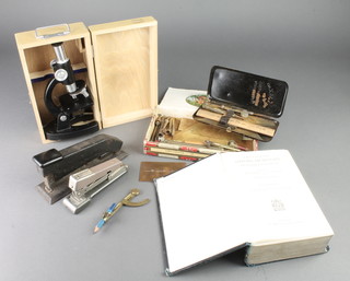 From the estate of Captain Eric M Brown, removed from Captain Brown's desk, a 1938 edition of the Precise Oxford Dictionary marked Eric Melrose Brown, a student's Okular microscope boxed, The Ajax set of mathematical instruments boxed, various compasses, 2 staplers and a copper card plate 3" x 2" 