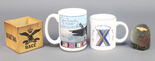 From the estate of Captain Eric M Brown a Society of Experimental Test Pilots pottery mug 38th Symposium 1984, a pottery mug to commemorate Jon Beesley's first flight of the F-35, an FAI 86th square pottery vase 3", a pen rest formed from a section of granite decorated wings 3" 