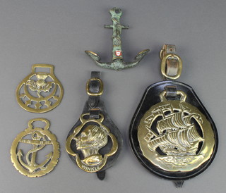 From the estate of Captain Eric M Brown, removed from Captain E M Browns fireplace in his sitting room, a leather martingale hung a horse brass in the form of the Dickensian character Winkle , a brass ditto decorated a galleon, 2 other horse brasses of an anchor and thistle, together with a verdigris metal corkscrew in the form of an anchor marked Kiel