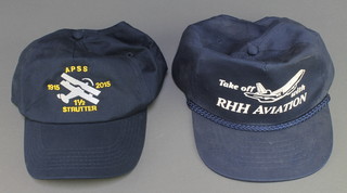 From the estate of Captain Eric M Brown a Take Off with RHH Aviation baseball cap, and an Apps 1 1/2 Strutter baseball cap 


