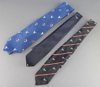 From the estate of Captain Eric M Brown a blue polyester striped tie, 1 other decorated a burgee flag,  and 1 other with stripes and helicopter impression