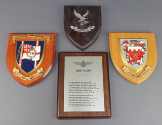 From the estate of Captain Eric M Brown a South African Air Force college plaque Bahrain Police Shield, an East Grinstead Royal Naval Association shield and a metal shield Hi-Flight with poem by John Gillespie Magee Jr. 