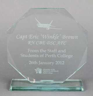 From the estate of Captain Eric M Brown a shaped glass presentation plaque to Captain Eric Winkle Brown RN CBE DSC AFC from the staff and students of Perth College 26 January 2012 University of the Highlands and Islands Perth College 8 1/2" x 8" 