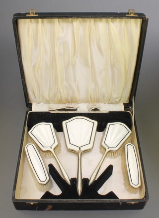 An Art Deco silver and guilloche enamel 5 piece brush set, cased, Birmingham 1932 